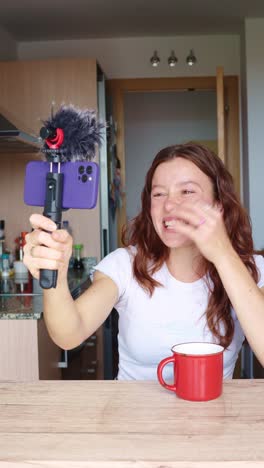 woman vlogging in kitchen