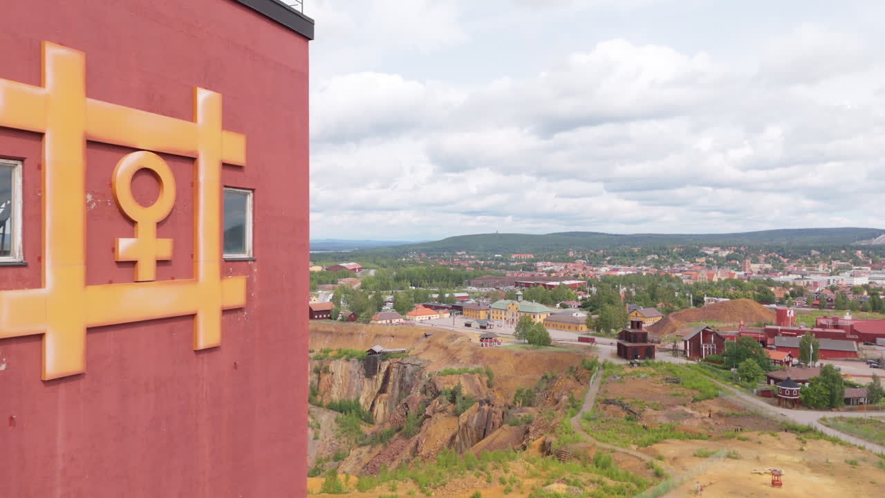 Iconic copper symbol on falu red tower at Falun copper mine in Dalarna Sweden