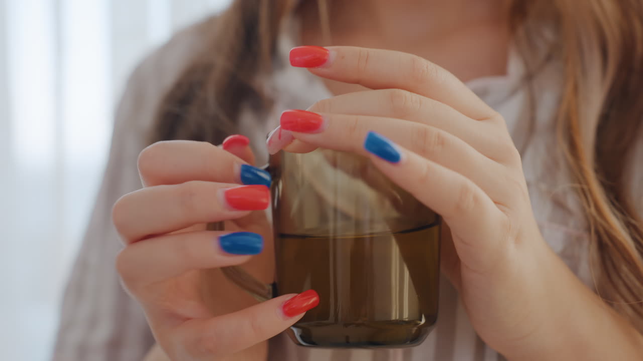 Closeup Of Elegantly Painted Fingertips, Refined Hands Showcasing Meticulously Decorated Nails Gripping Cup, Sophisticated Manicured Hands With Beautifully Painted Nails Clutching Mug