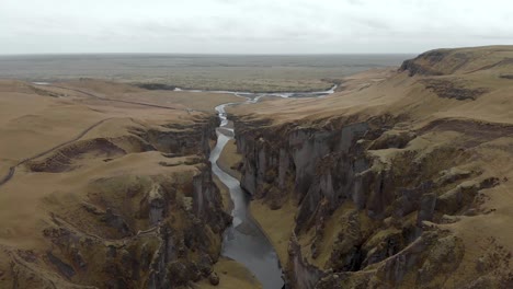 cinematic aerial flyover of stunning icelandic canyon