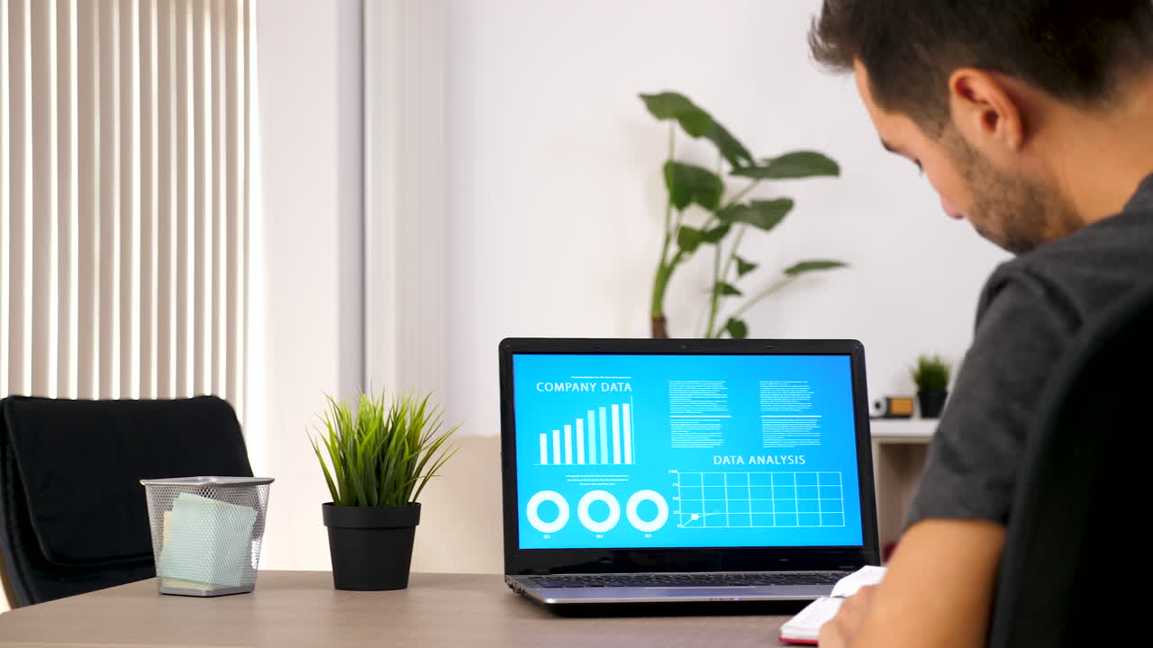 Data analysis on a laptop in an office setting