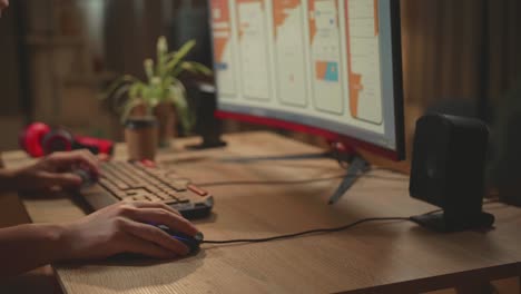 close up of the man's hand mobile application developer works with graphics on his personal computer
