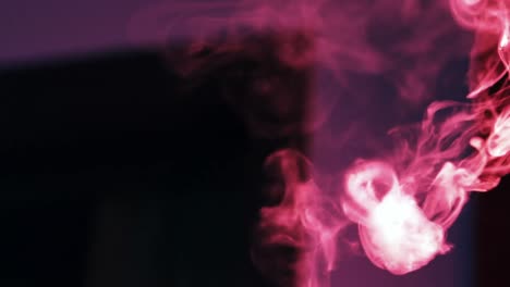 Smoke-rising-on-dark-background