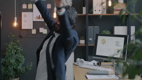 businessman stretching in the office