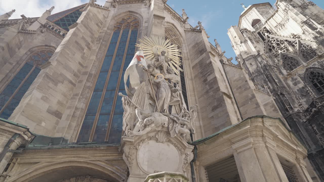 Architectural view of a church and statue