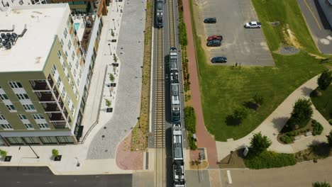 Aerial-Tracking-Shot-of-Light-Rail-Train-in-Charlotte,-North-Carolina