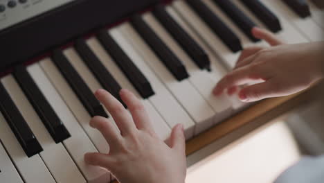 kid musician performs composition on piano with inspiration