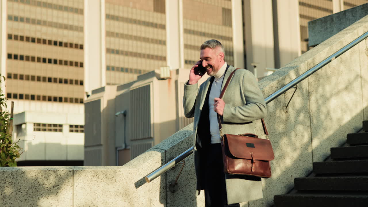 Man on stairs talking on cellphone