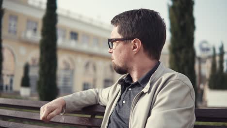 man sitting on bench in park