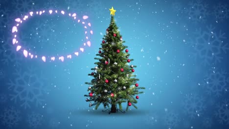 Decorative-shining-lights-against-snowflakes-falling-over-christmas-tree-against-blue-background