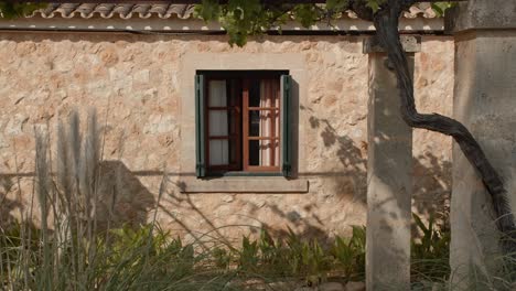 amazing view of big glass window in an historic and sweet house in middle of field