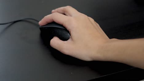 hand interacting with a computer mouse