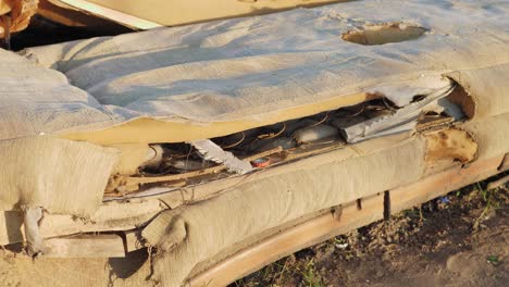 Brown-old-dilapidated-couch,-set-in-the-middle-of-nowhere