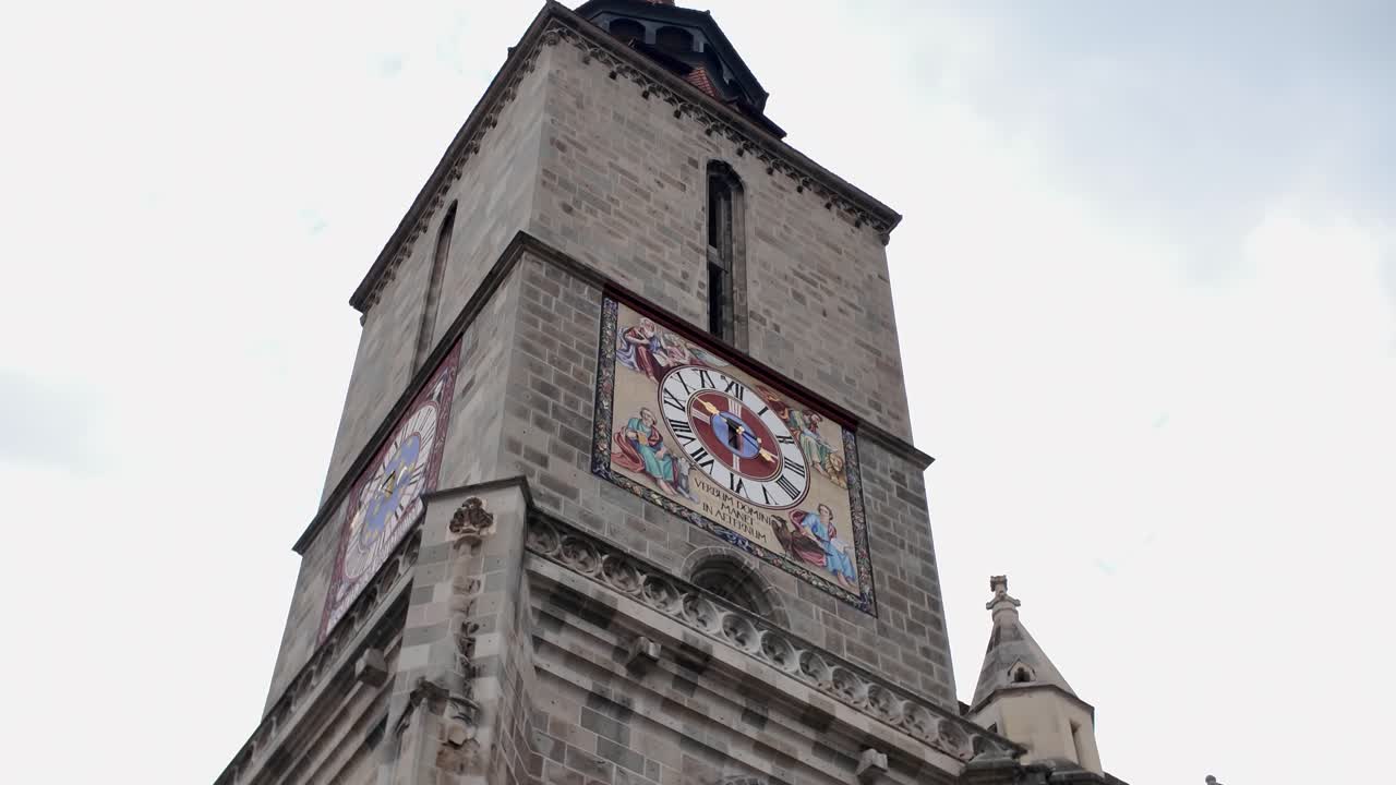 Pan highlighting the architectural details of the iconic clock tower of the Black Church