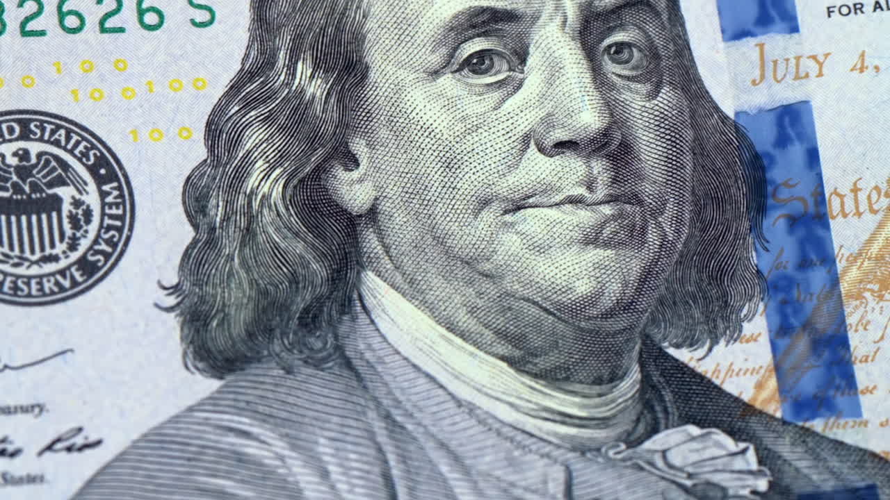 Close up of Benjamin Franklin on the 100 dollar bill