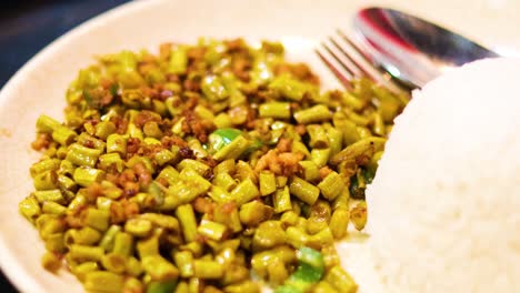 savory dish served with rice and beans