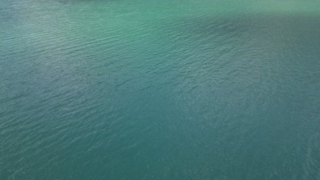 texture background of calm waves in walensee lake water of switzerland