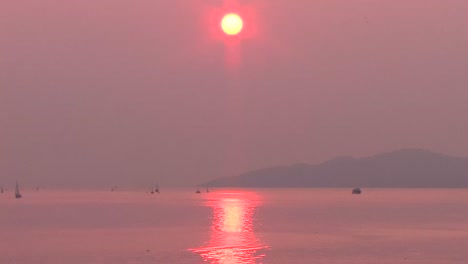 forest fire smoke creates unusual sunset. smokey sunset