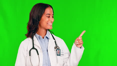 Healthcare,-pointing-and-a-doctor-woman-on-a-green