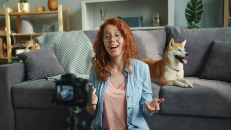 young woman vlogging with dog