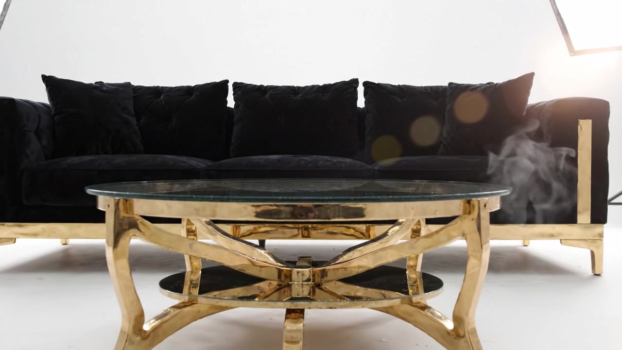 Luxurious Black Couch and Glass Coffee Table in a Bright Studio Setting with Professional Lighting for Modern Aesthetic Home Decor Showcase
