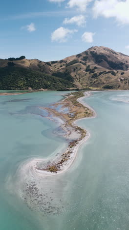 aerial view of coastal landscape with island and bay