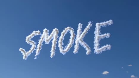 skywriting displays the word 'smoke' against a clear blue sky, capturing the art of aerial messages