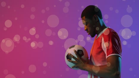 Animation-Eines-Afroamerikanischen-Männlichen-Fußballspielers-über-Flecken