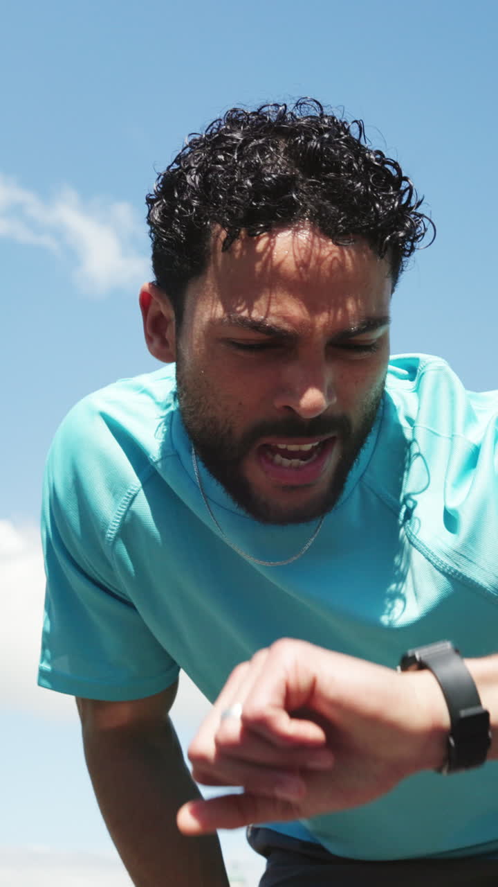 Tired Man Breathing Heavily and Checking Smartwatch After Workout