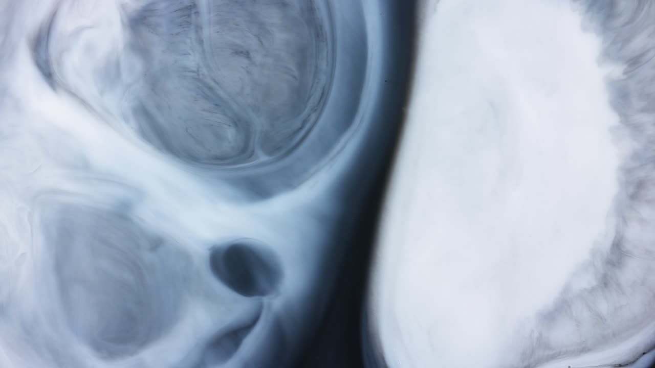 Abstract black and white wave pushing back paint swirl in chain reaction
