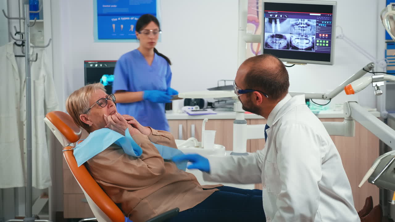 Retired woman having symptoms of gums pain