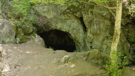 Panning-at-the-entrance-of-a-cave-in-a-place-known-as-the-location-of-the-tomb-of-the-Egyptian-goddess-Bastet,-up-the-Strandzha-Mountain-in-Bulgaria