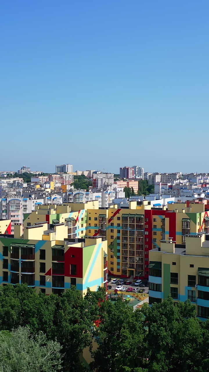 View from the drone at the new construction of modern tower building. Exterior of a new architecture in the city. Building of high-rise house concept Vertical video