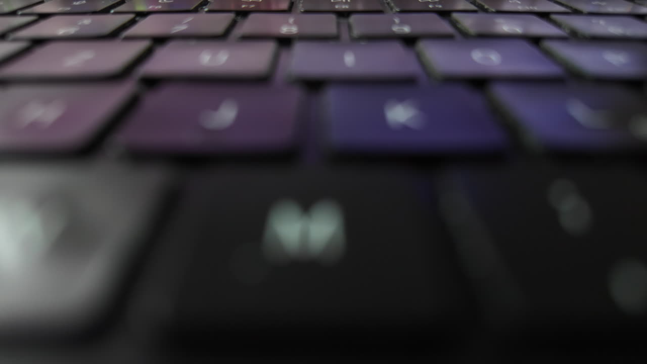 Laptop keyboard close-up, with blurred details