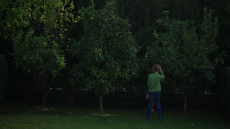 Siblings-playing-with-ball-outdoors