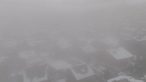 Switzerland fog and clouds: view of famous alpine ski resort winter Swiss Alps, snow on mountain slopes