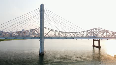 aerial view around the abraham lincoln bridge in louisville, sunset in ky, usa - circling, drone shot