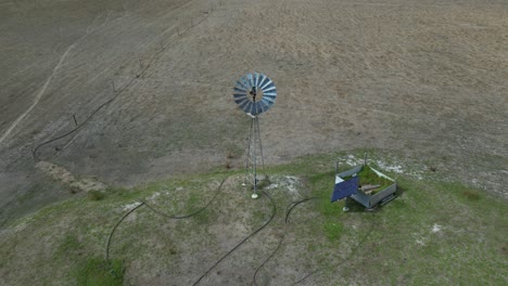Windmill-at-farm-with-spinning-blades,-Margaret-River-Region-in-Western-Australia