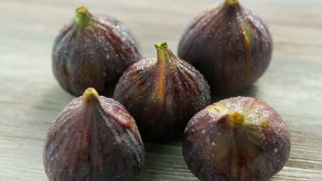 wet washed whole figs on table