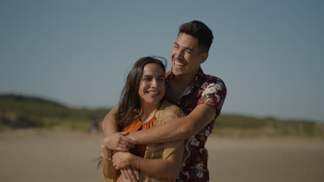 happy couple hugging and smiling
