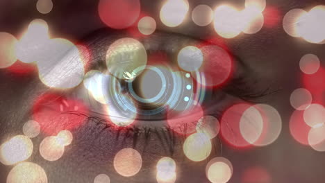 manchas de luz rosadas brillantes contra el escáner redondo sobre el ojo femenino