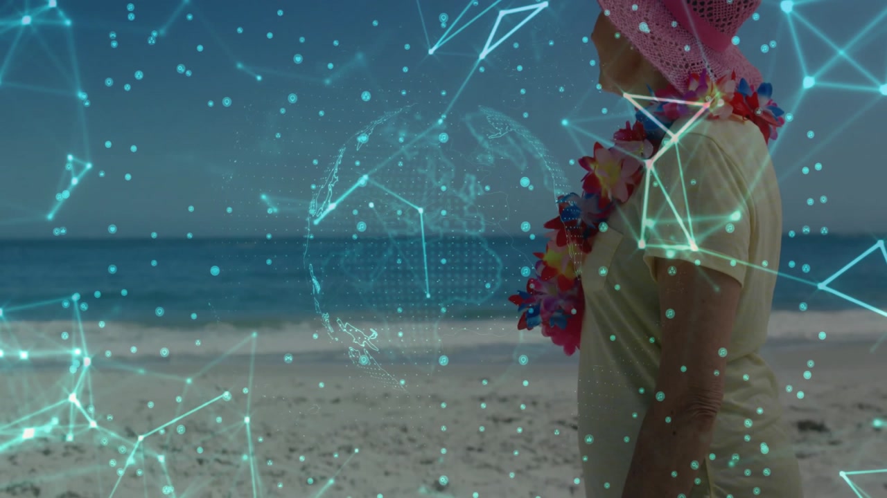 Turquoise network fading over beach visualizing connection with rotating globe while woman standing