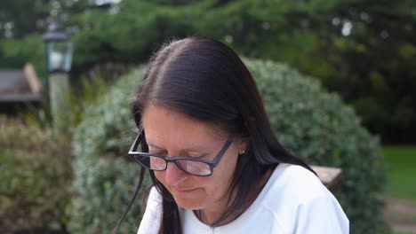 Close-up-Of-An-Adult-Woman-Wearing-Glasses-And-Smiling