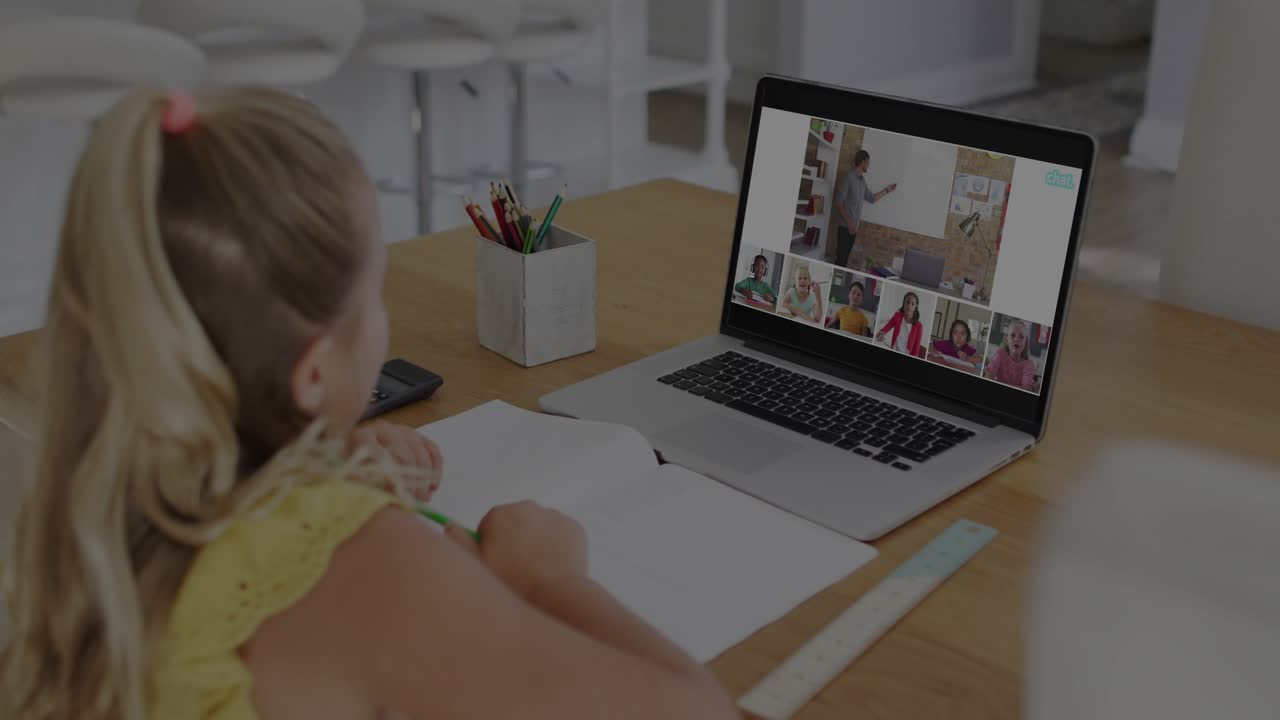 Girl writing in home study while laptop showing teacher and starting HUD securing remote education