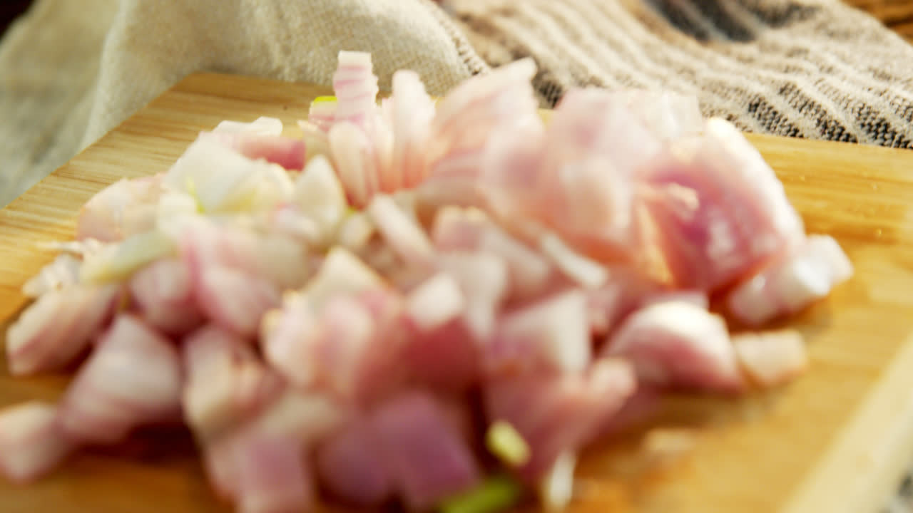 Chopped onion on chopping board 4k