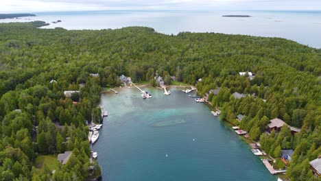 Aerial-view-of-Big-Tub-Harbor,-the-Sweepstakes-shipwreck-visible-at-the-bottom