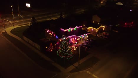christmas decorated homes in a city at night