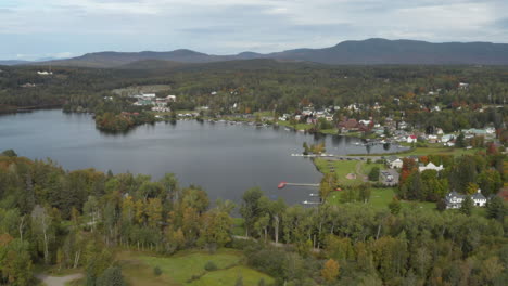 wide angle drone shot of downtown rangeley and city cove in maine