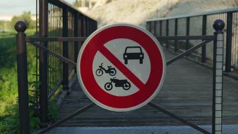 circle sign showing motorcar and motorcycles