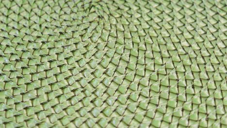 homemade green textured doily rotating in the frame